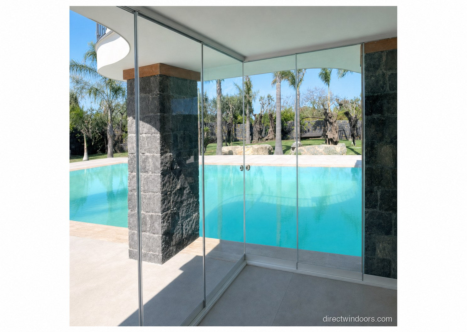 Frameless glass walls corner installation at a stone pool patio, side view