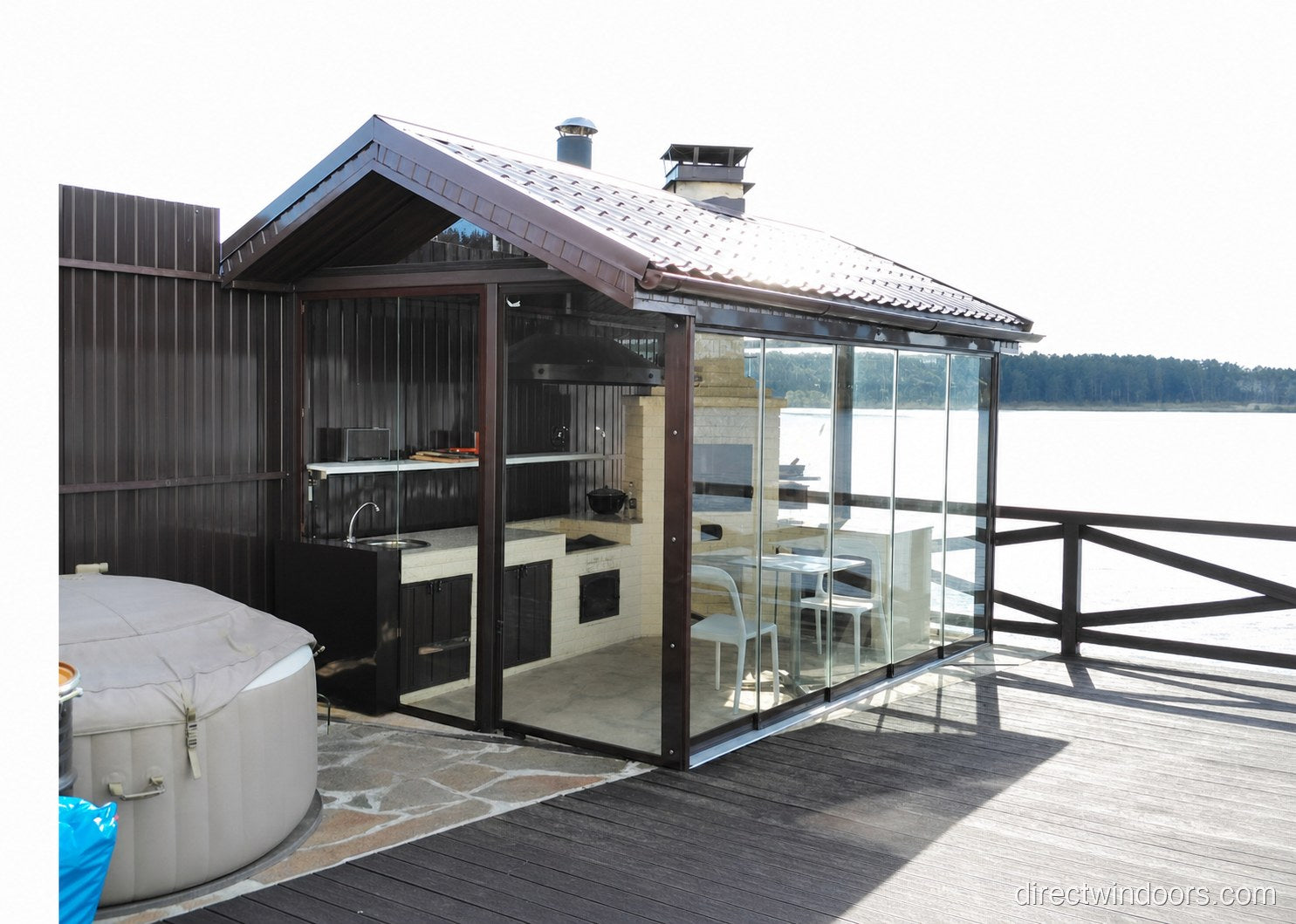 Frameless glass walls enclosing a hot tub deck for year-round use