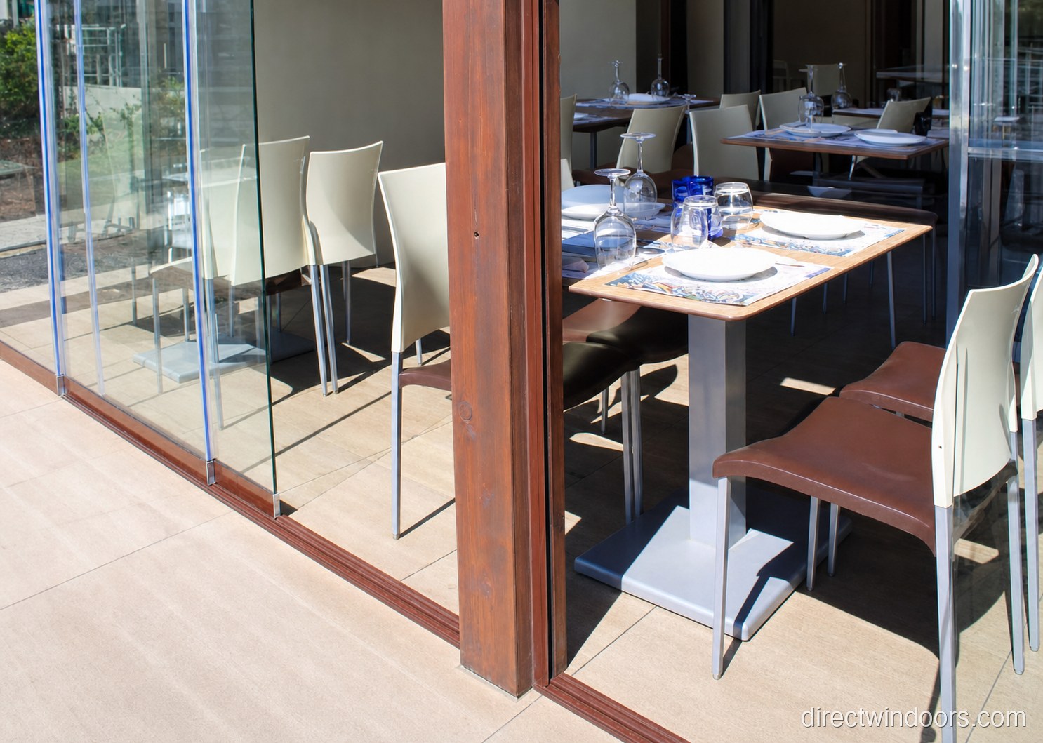 Frameless glass walls wall-mount detail at a restaurant installation
