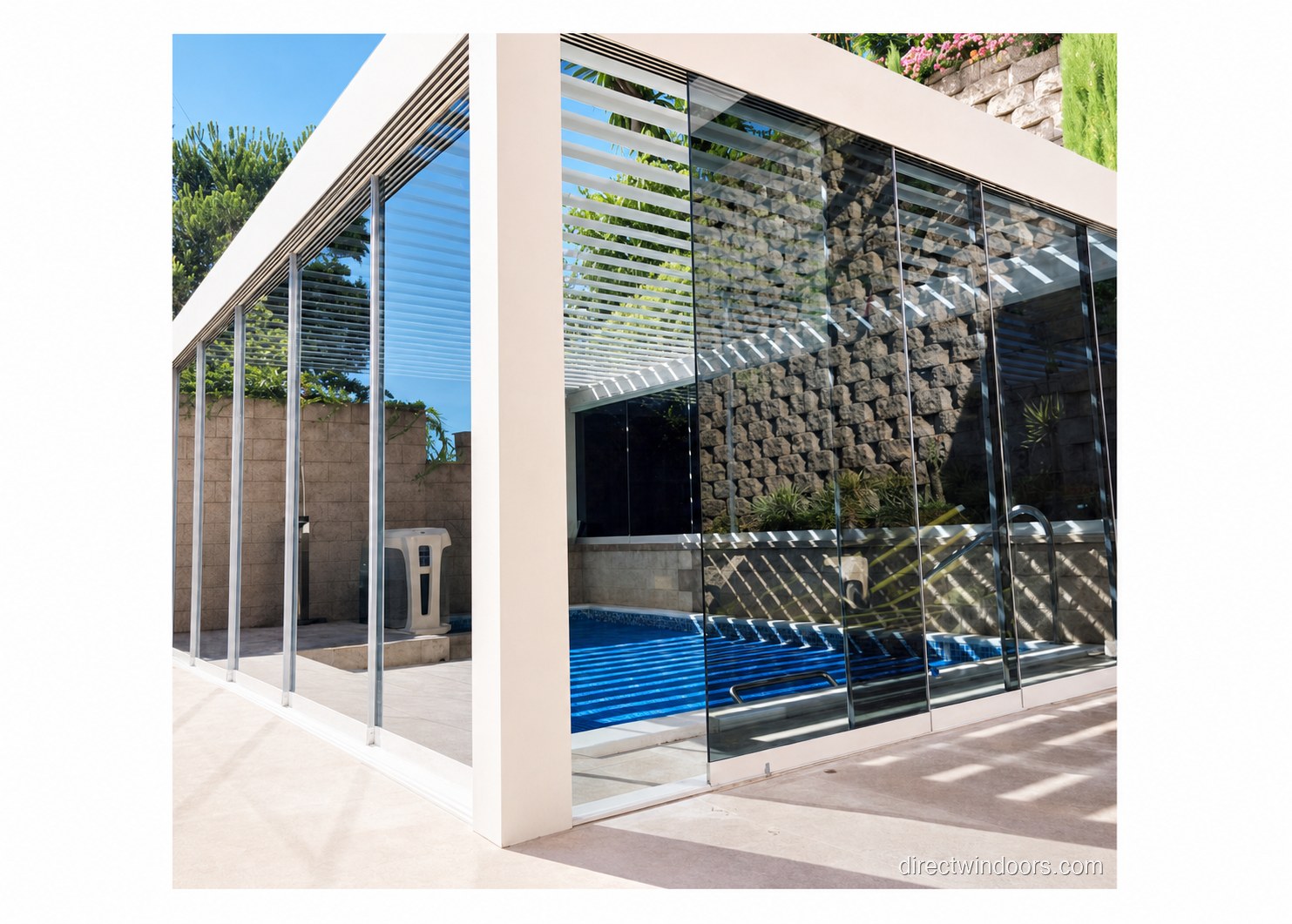 Tinted frameless glass walls at a backyard pool with solar shade